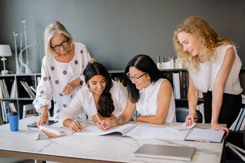Small business team planning health benefits together in a modern office