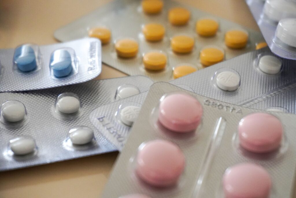 Close-up of assorted colorful pills in blister packs, illustrating Medicare Part D changes for 2027